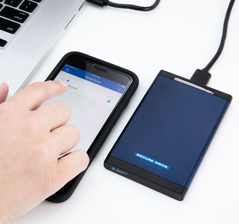 An image of a person using the SecureDrive® BT encrypted external drive.