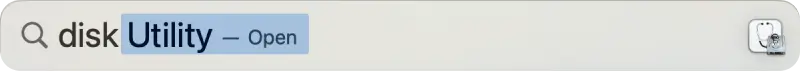 Screenshot showing Disk Utility in Spotlight search.