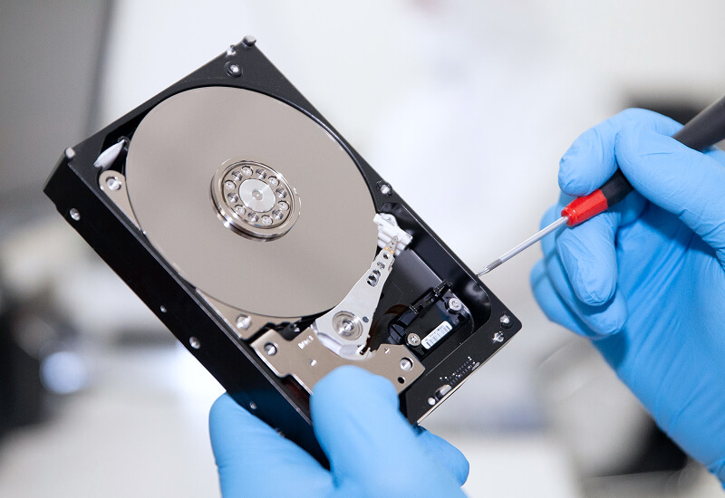 An image of the inside of a hard drive in a cleanroom environment.